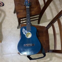 A 31 Inch Dark Blue First Act Discovery Guitar 