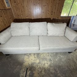 Used like new Gray Sofa  3–4 Seats; Easy to Clean; Smoke-Free, Pet-Free Environment Delivery Available Upon Request