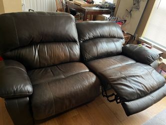 Brown leather reclining couch