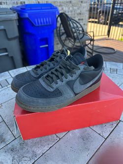 Nike Air Force 1 Low in a black and gray suede colorway