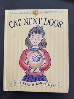 The Cat Next Door: A Magic Charm Book by Elizabeth Koda-Callan