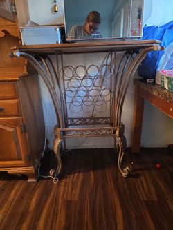 Wood table , holds wine bottles