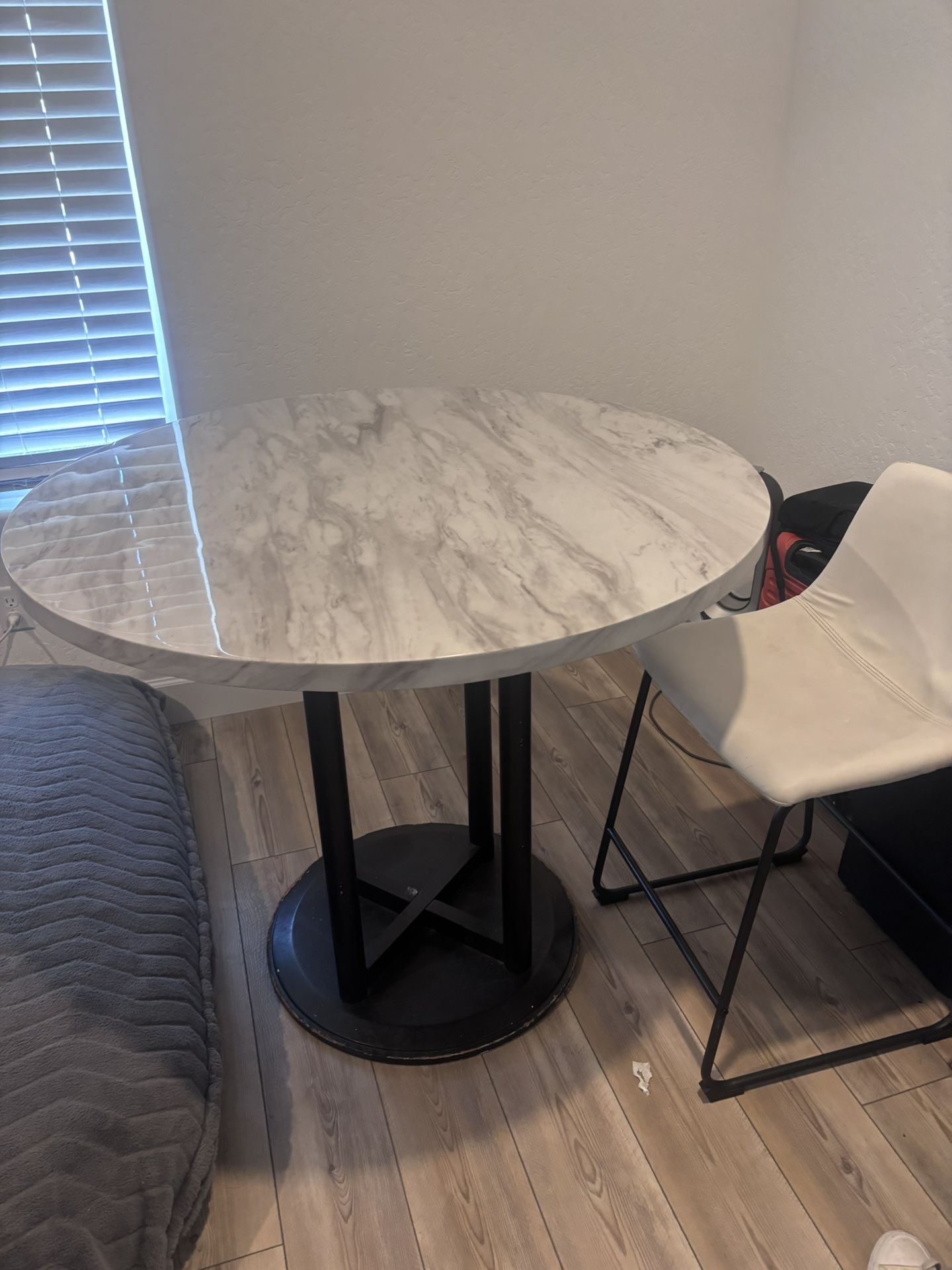 Table and 4 white chairs