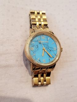 Michael Kors gold watch with turquoise face