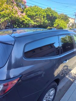 Gray SUV with Roof Rails and Tinted Windows