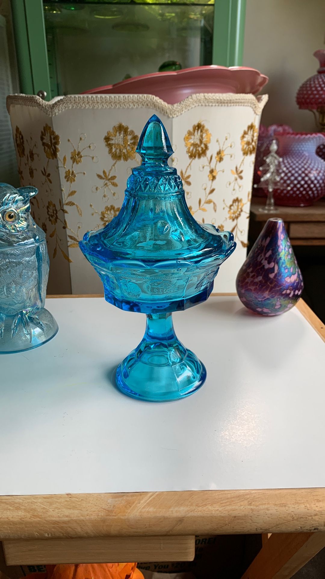 Vintage Tiara glass blue glass footed candy dish with strawberry pattern.