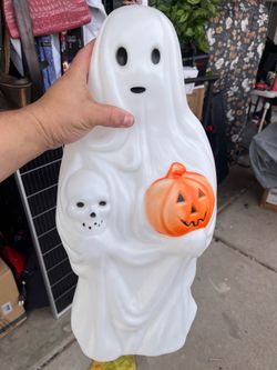 vintage 23-inch Empire Plastics Halloween blow mold ghost featuring a painted pumpkin and skull