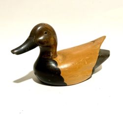 vintage hand-carved wooden duck decoy, likely made for decorative purposes or as a hunting accessory that has since become a collector's item. It is h
