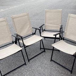 Four Outdoor Patio Folding Chairs