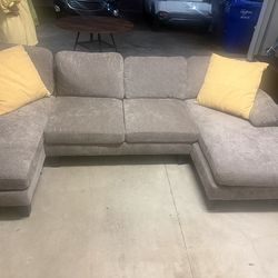 3 piece Grey Plush sectional couch , 2 yellow throw pillows