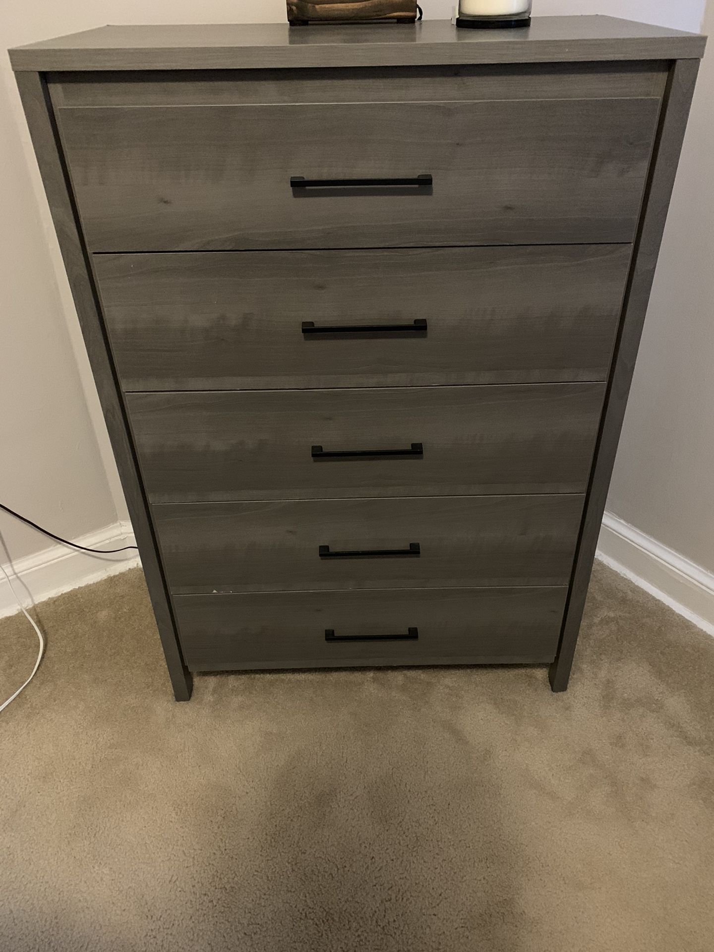 5 drawer dresser with some scrapes and scratches.