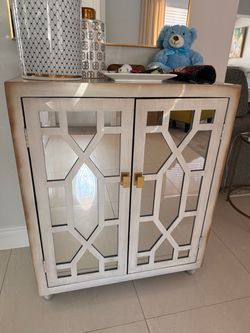 Mirrored Two-Door Cabinet with Gold Hardware