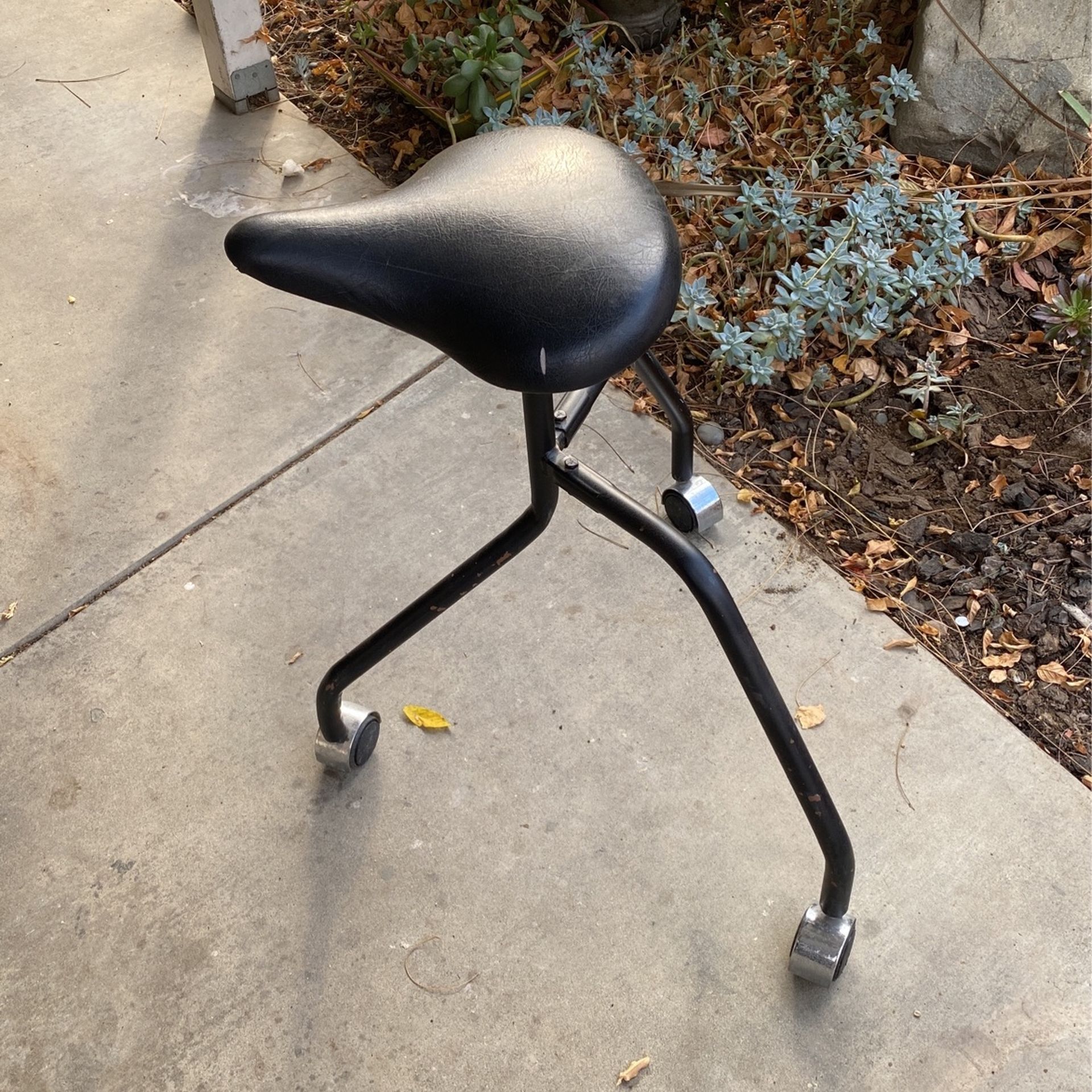 Cushioned Three Legged Stool On Wheels