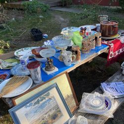 Table full of miscellaneous stuff and fair like collectibles