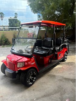 Red Tomberlin 6-Seater Golf Cart