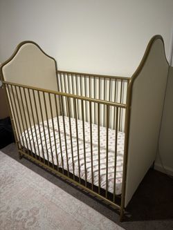 Gold Upholstered Metal Crib With Toddler Bed Rail and Mattress