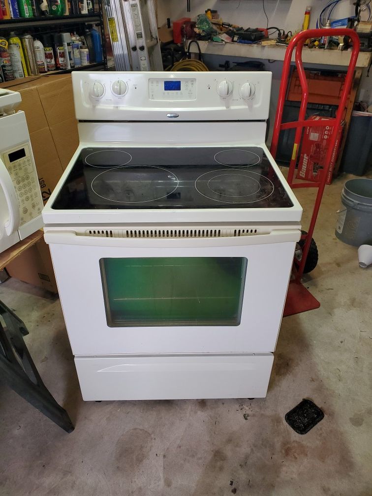 Complete kitchen appliance set. Refrigerator, stove, microwave and dishwasher.