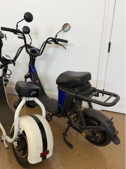 Blue CityCoco-style seated electric scooter/e-bike