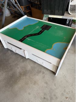 Solid train table with trundle drawers
