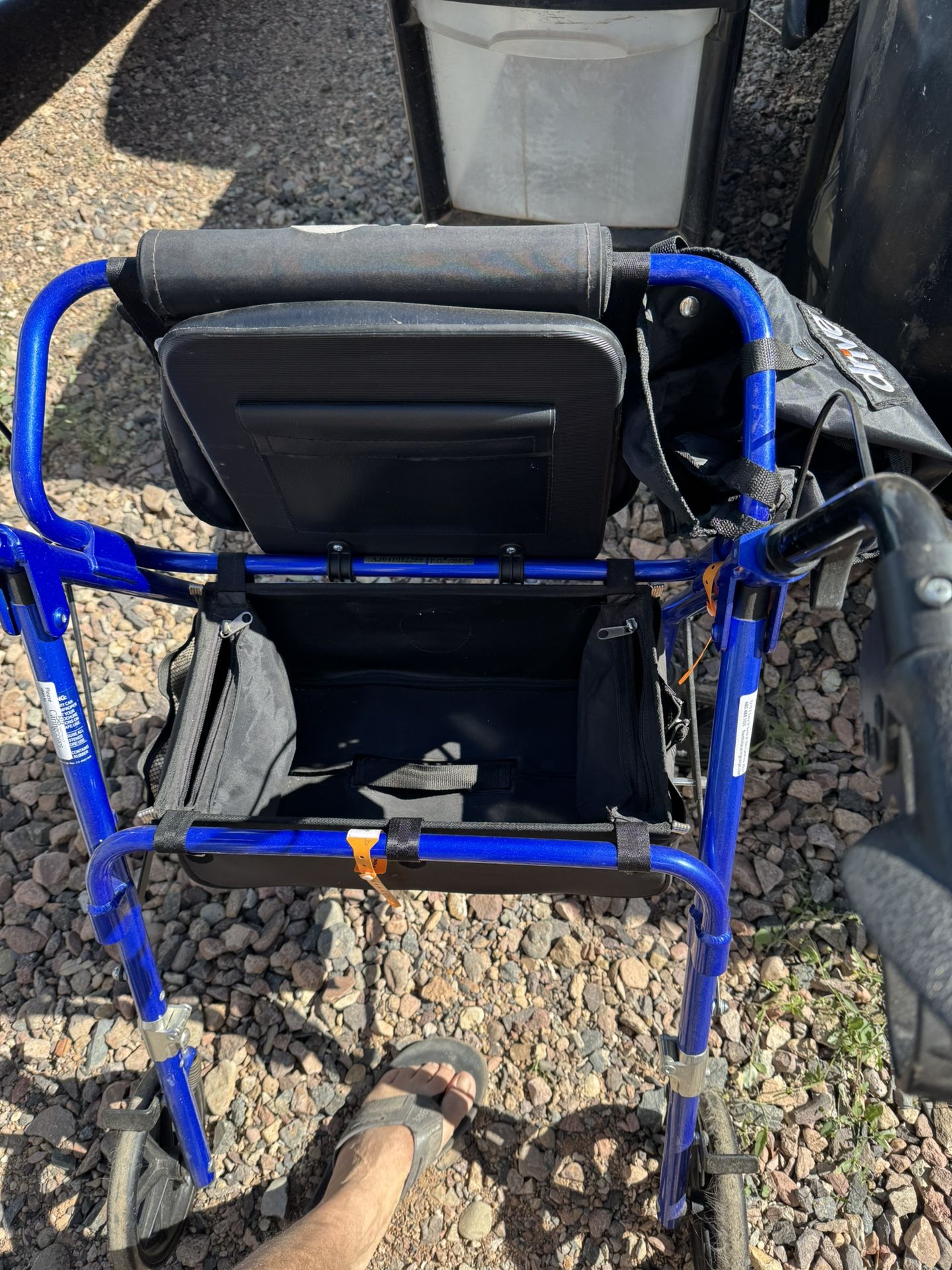 Blue Rollater Walker. Comes With Extra Storage Attachments
