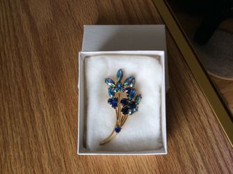 Blue rhinestone lapel pin