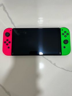 OLED Nintendo Switch Console with Colored Controllers and Charger