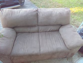 Tan suede loveseat