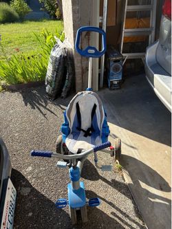 Kids push tricycle
