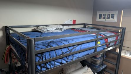 Metal loft bed frame with integrated desk. $200