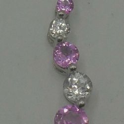 10KT WHITE GOLD PENDANT WITH WHITE AND PINK STONES 0.7 GRAMS MINT CONDITION. 858742-10