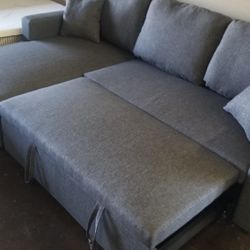 Small reversible sofa chaise sectional with a pullout bed