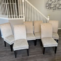 6 upholstered ivory dining chairs in good condition, some fabric areas are worn on seats   20”W x 42”T x 20”D  Seat height 19” Price is firm, price is