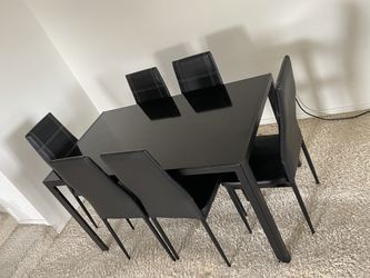 Black glass dining table and six chairs