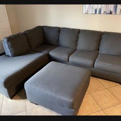 Charcoal Grey Sectional couch with matching ottoman from Ashley Furniture