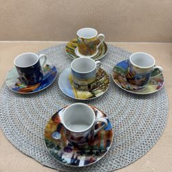 A set of five espresso cups and saucers