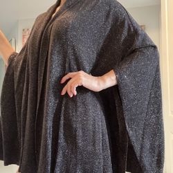 Sparkling strands radiate contemporary style on a very soft Calvin Klein shawl generously sized  One Size fits all 