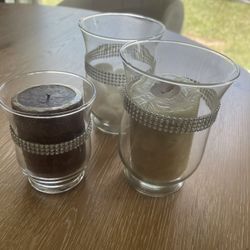 3 Candles and Candle Holders. 