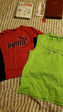 2 spot pullovers, one Puma size S one Reebok size XS