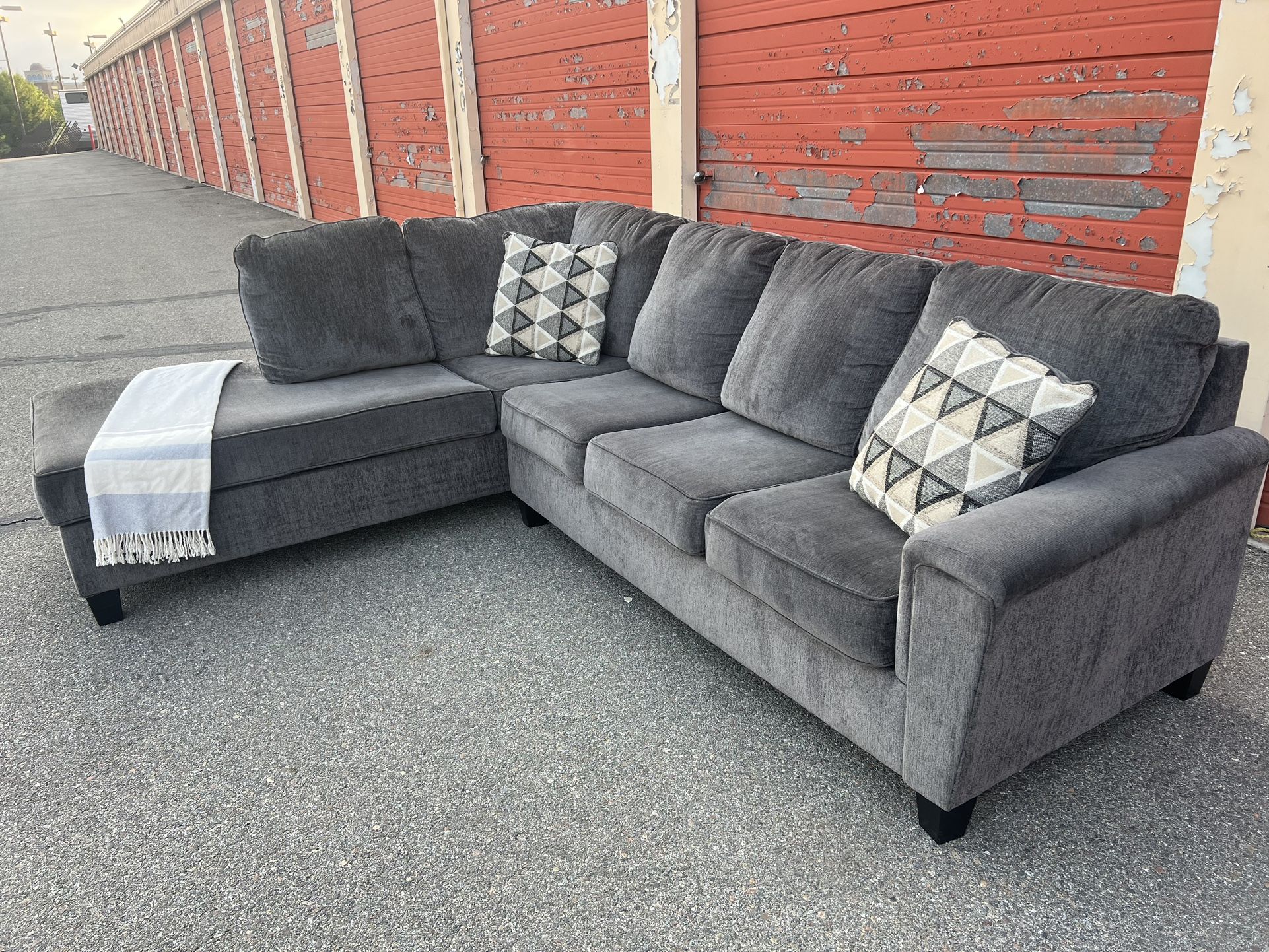 Ashleys Gray sectional sofa couch left facing chaise