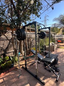 OLYMPIC SQUAT RACK WITH OLYMPIC WEIGHTS AND BENCH