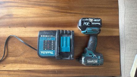 Makita impact drill with battery and charger