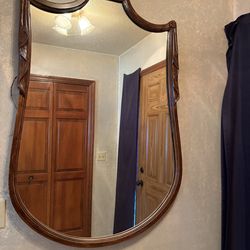 Antique ornate wooden mirror