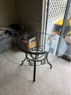 Glass table with 4 chairs