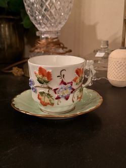 Porcelain Teacup and Saucer with Floral Relief