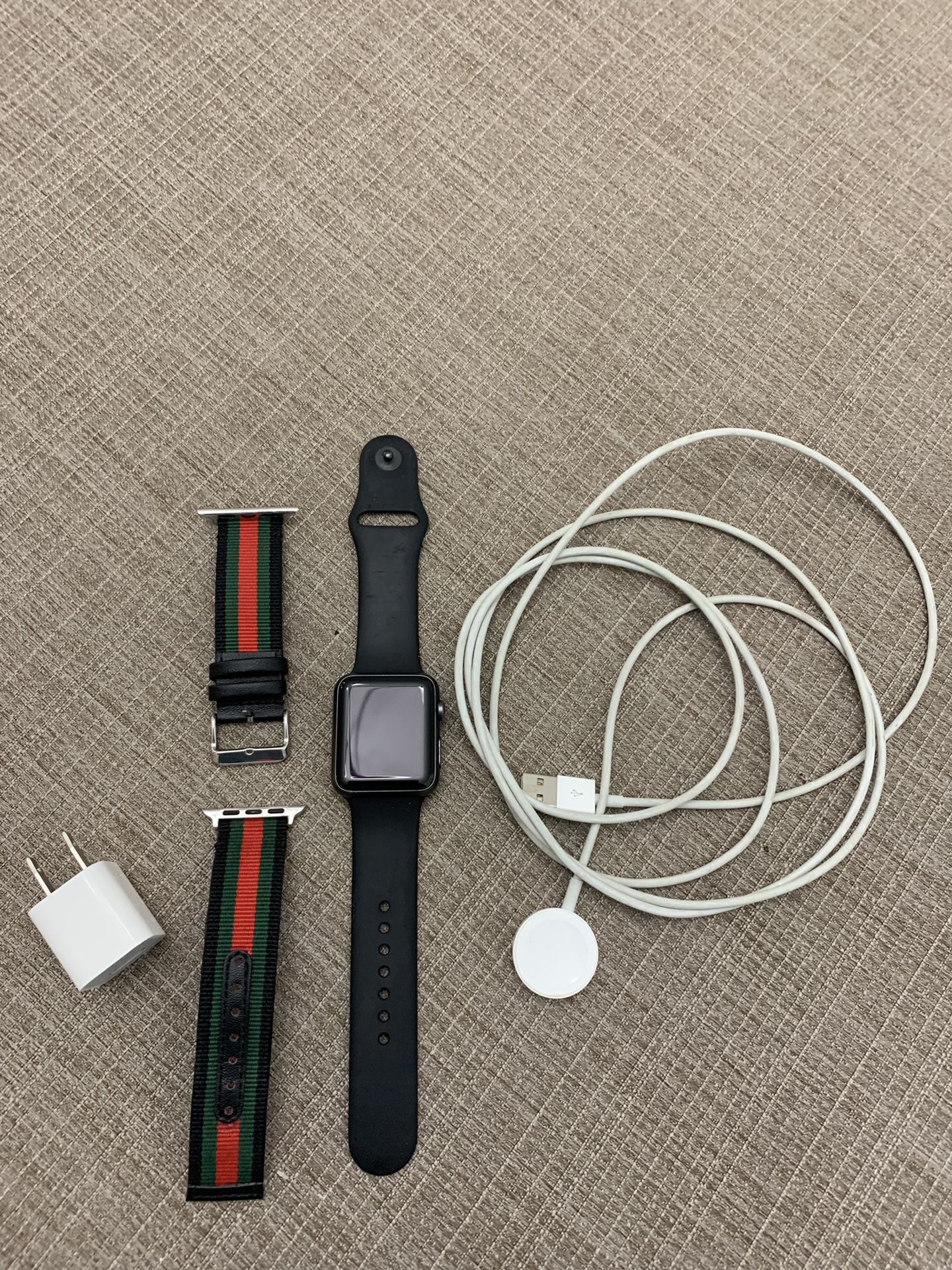 Apple Watch series 1 with 2 bands and charger.