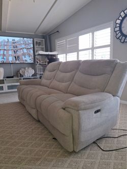 Tan/off white recliner sofa love seat.