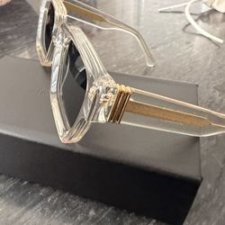 James Oro Clear Frame Sunglasses with Gold Accents and Black Lenses