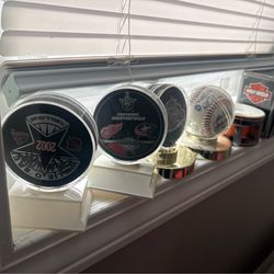 Game used hockey pucks and autographed baseball