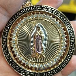 Medallon giratorio en oro laminado de la Virgen de Guadalupe