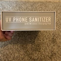 Wireless charging pad with UV sanitizer 